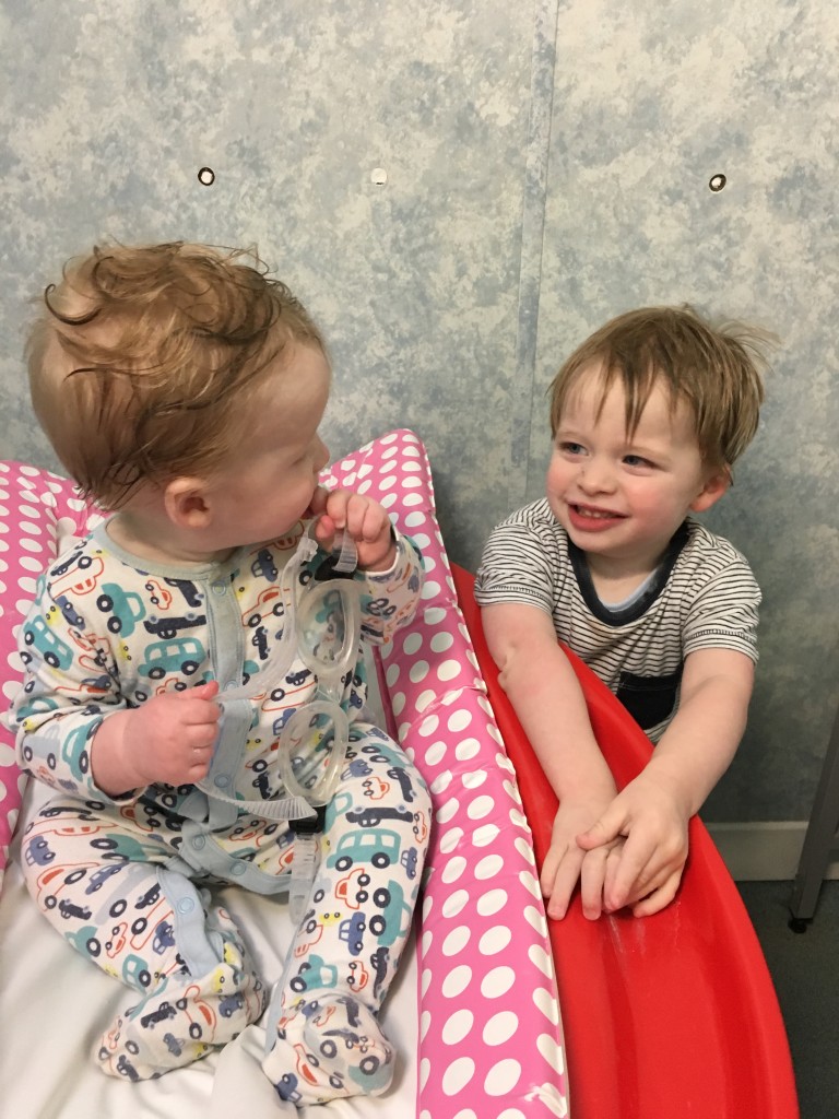 siblings helping each other out right from the start water babies swimming look of love adoration