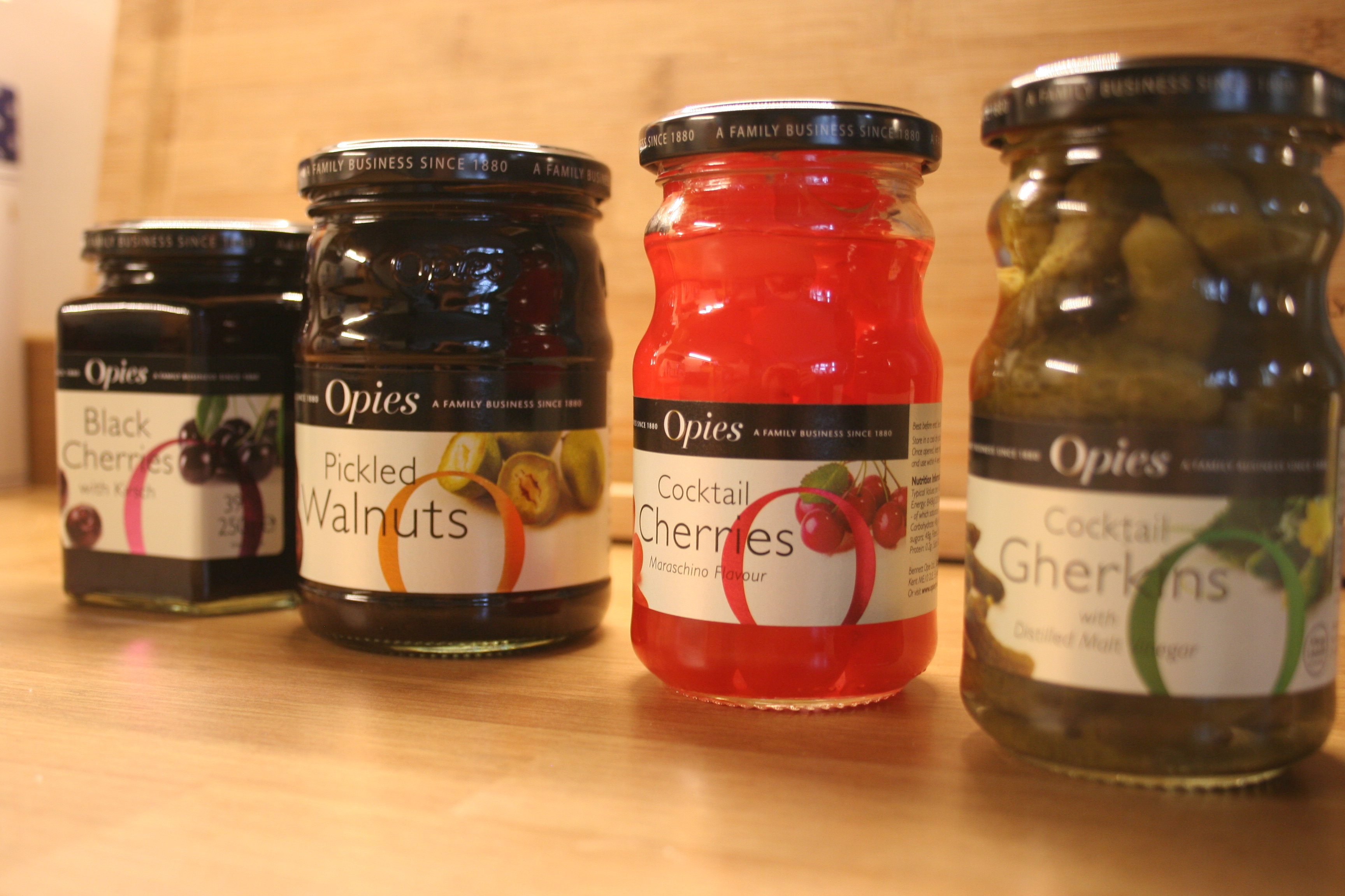 opies family business since 1880 store cupboard staple items best sellers black cherries with kirsh pickled walnuts cocktail cherries cocktail gerkins snacks