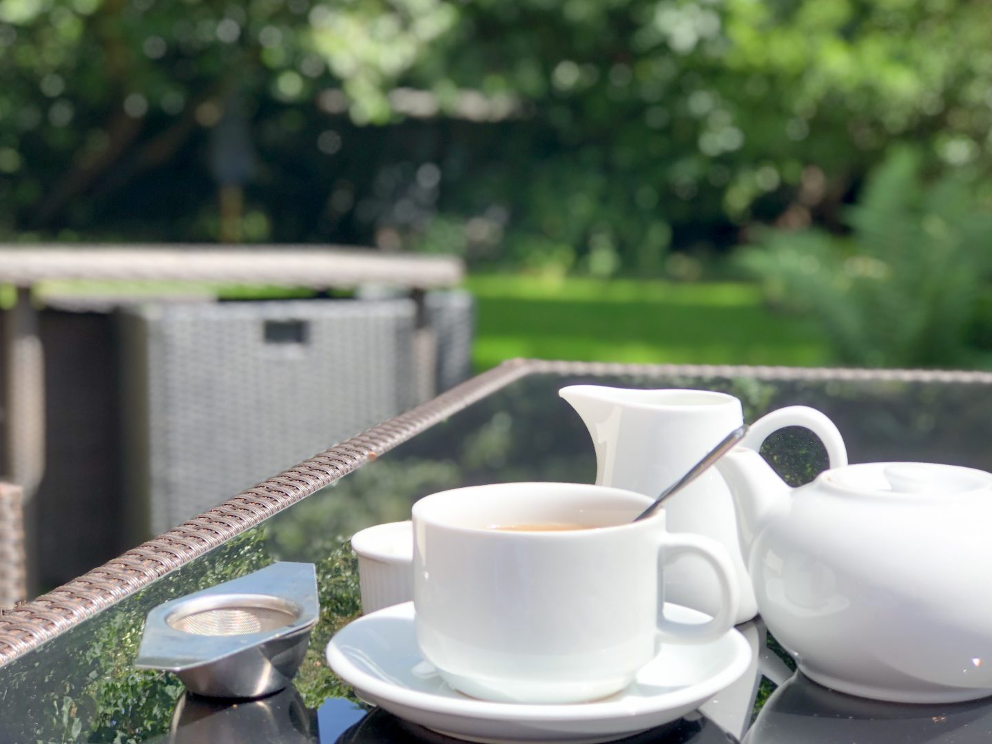 the grove hotel cromer afternoon tea outdoor table white tableware cup of tea