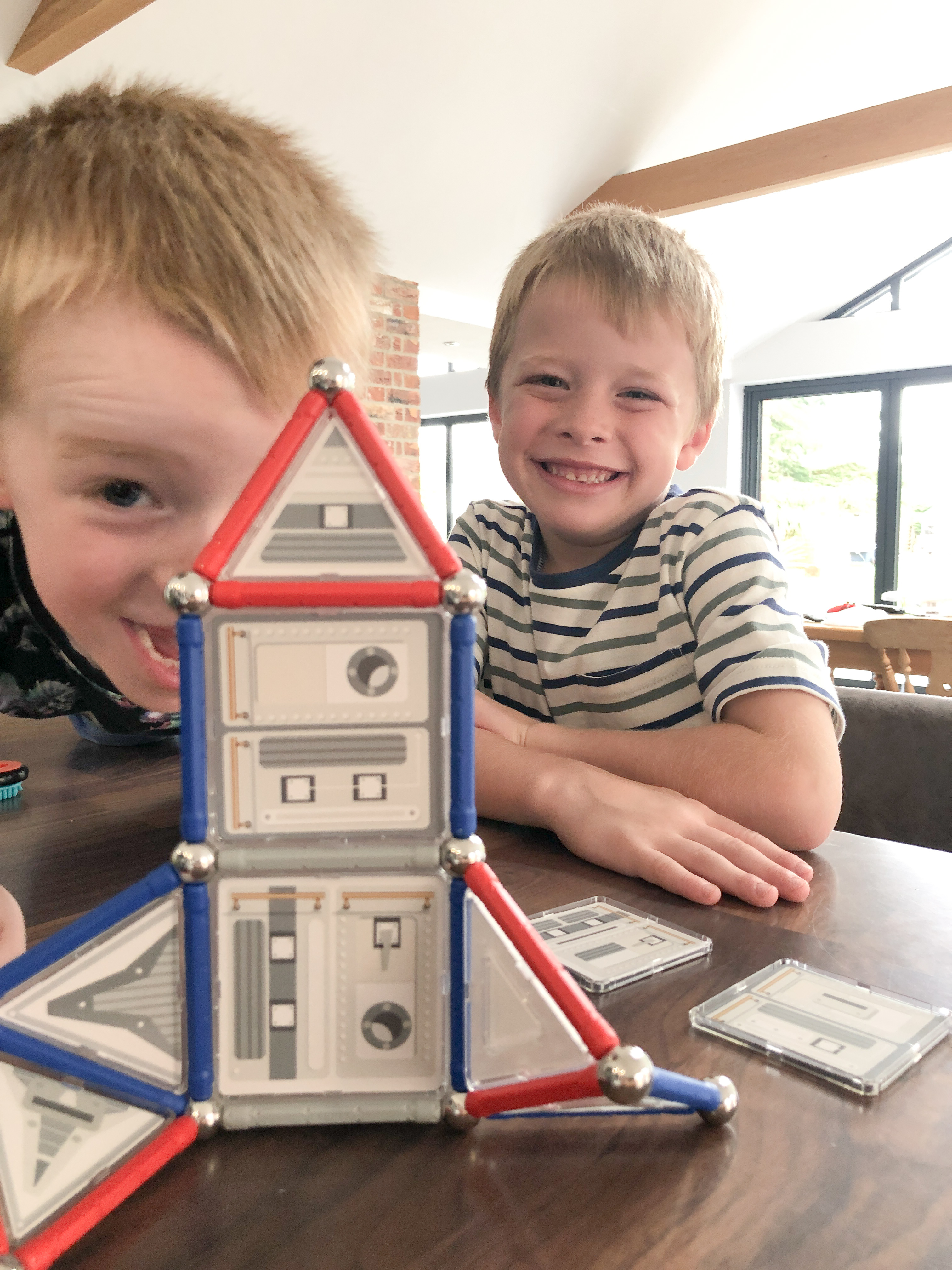 Boys showing off geomag rocket fully constructed
