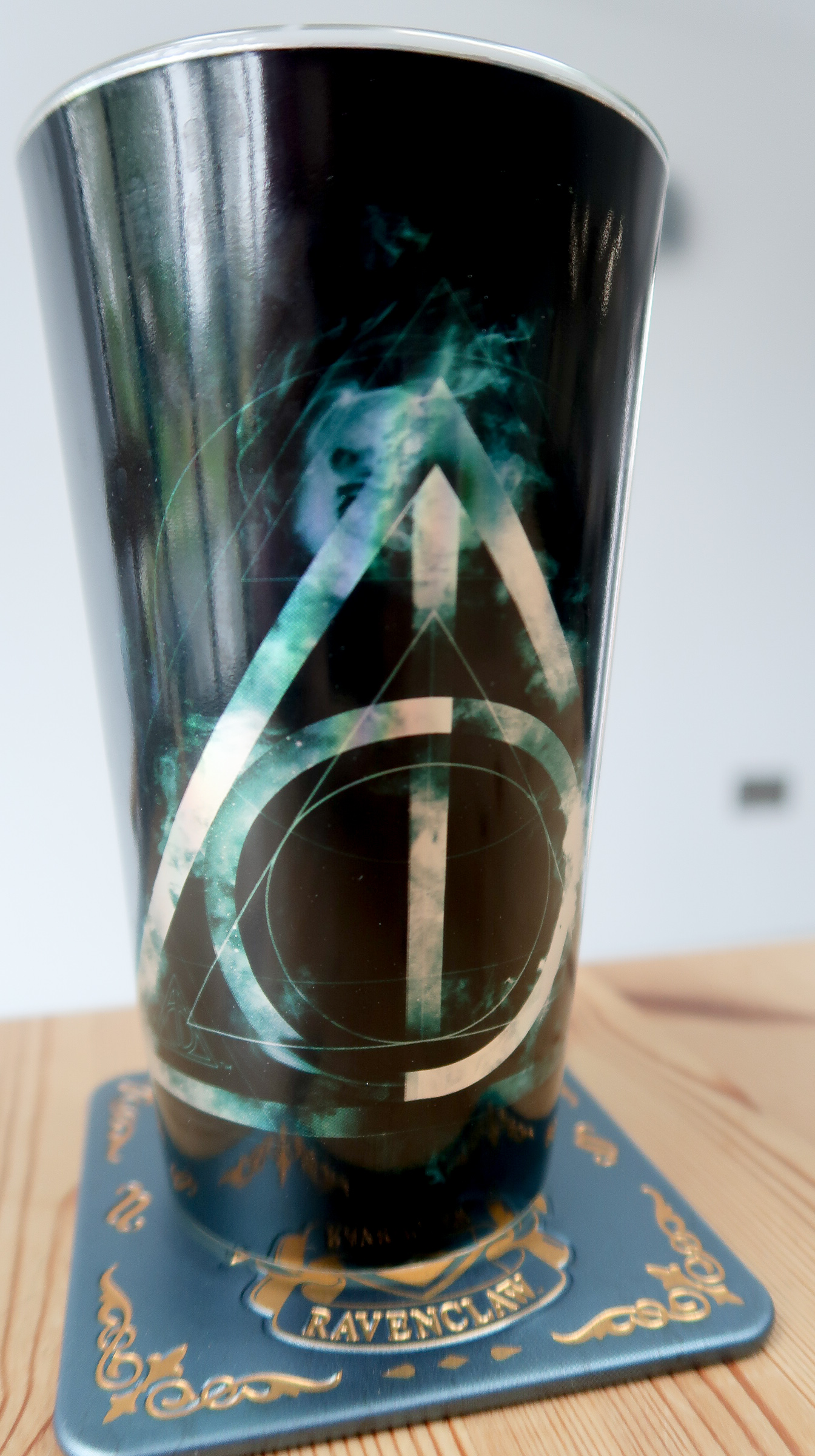 Harry Potter Deathly Hallows water glass on Ravenclaw coaster