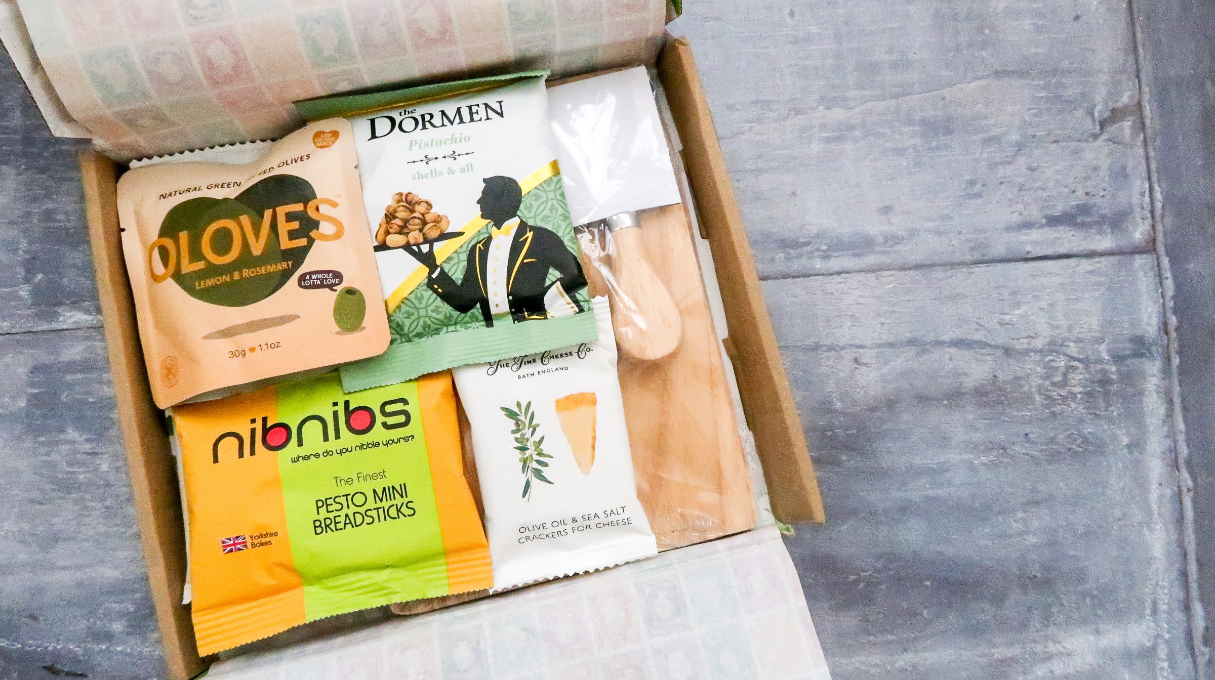 Contents of letterbox hamper include oloves olives dormen pistachios and other sample sized goods