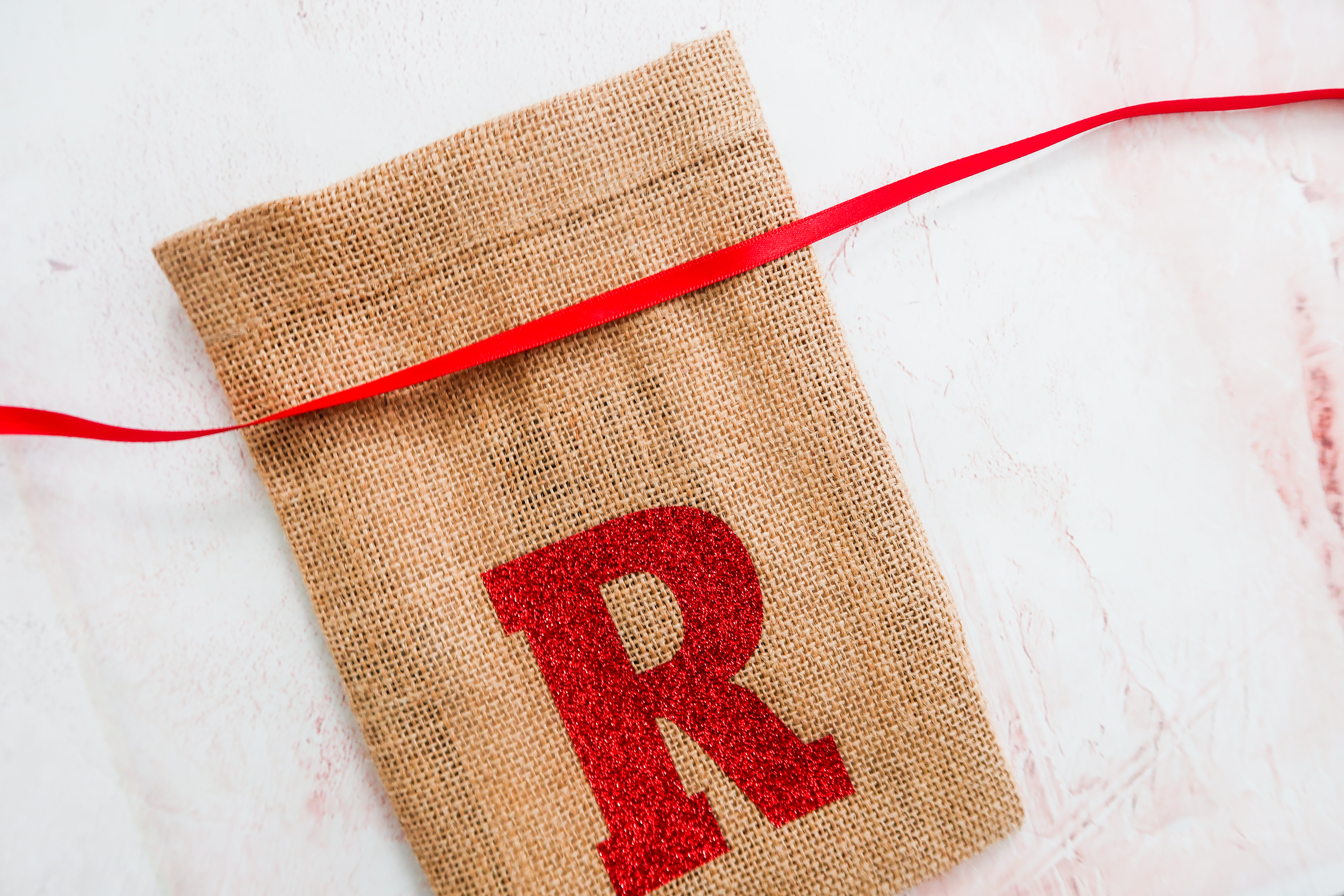 alternative idea for table place setting mini christmas sacks with initial 
