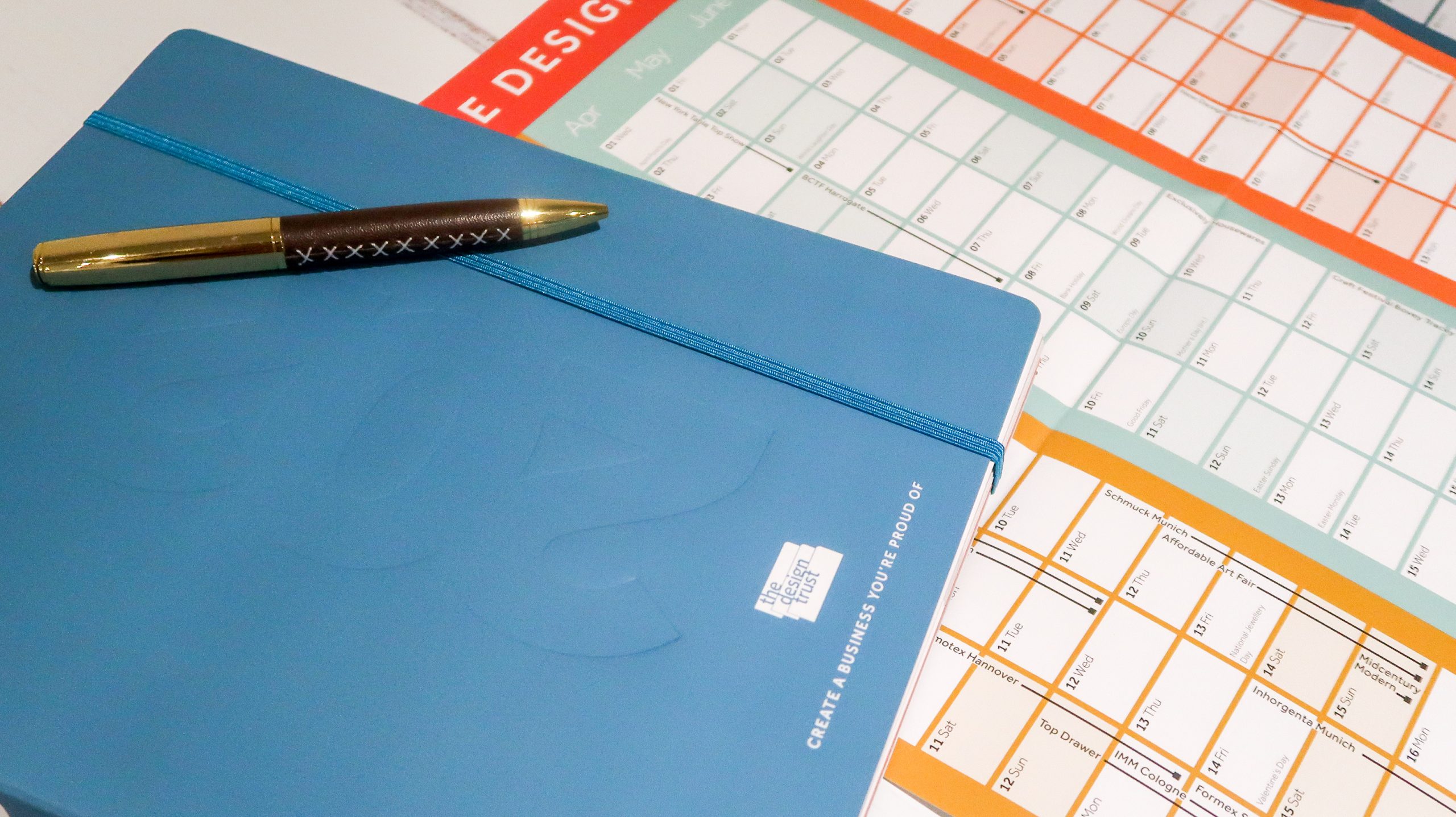 planner and annual wall planner together with a pen